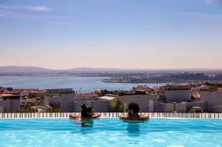 View of the Tejo River from the rooftop pool at Lisbon's Epic Sana Hotel