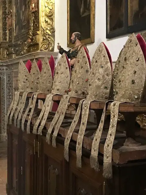 Bishop's mitres on display in the Lisbon Cathedral.  The cathedral is commonly known at Sé Cathedral, or "Seat of the Bishop."