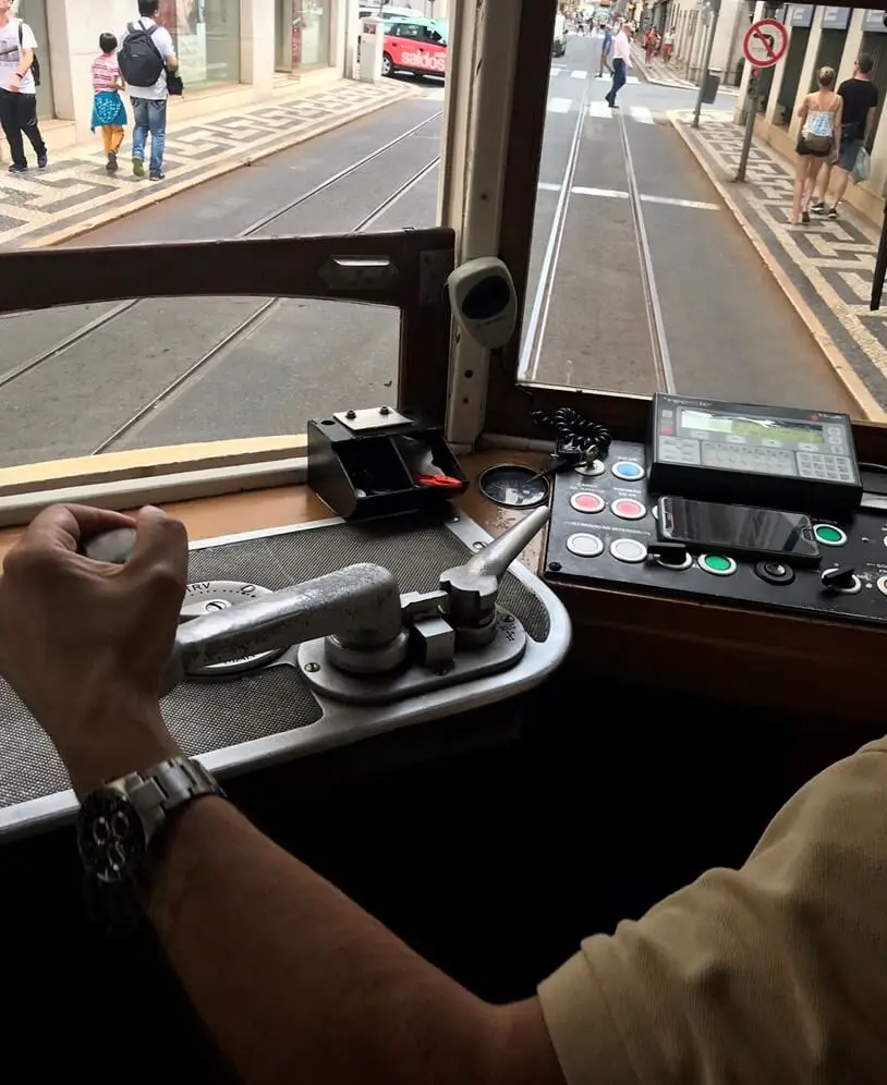 The driver at the controls of Lisbon's Tram 28