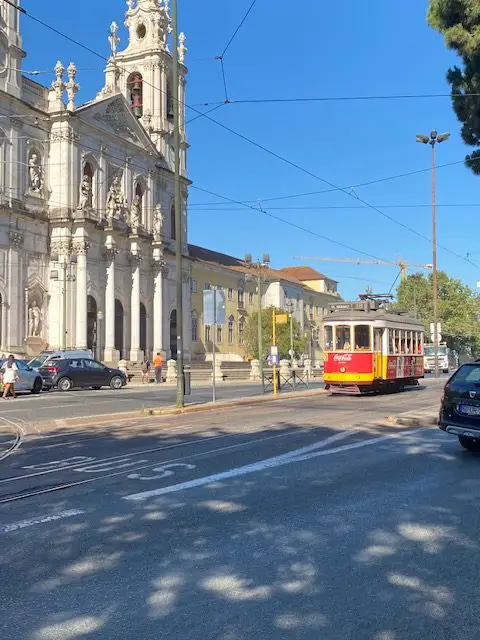 Lisbon's Tram 28E passing by the Basíilica da Estrela in 2022