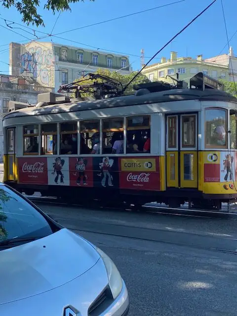 Lisbon's Tram 28 negotiating traffic