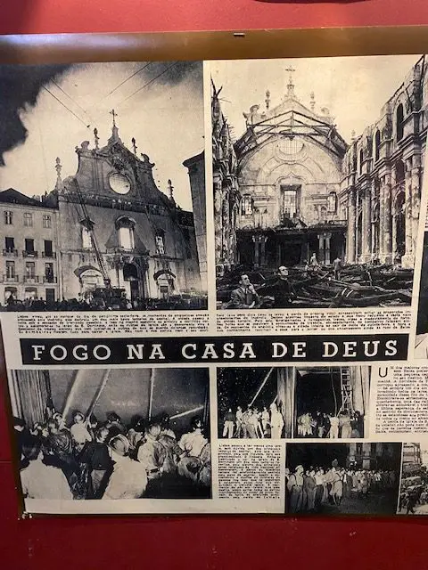 A headline in a Lisbon newspaper declares "Fogo na Casa de Deus!"  "Fire in God's House!" following the fire at São Domingos Church in 1959