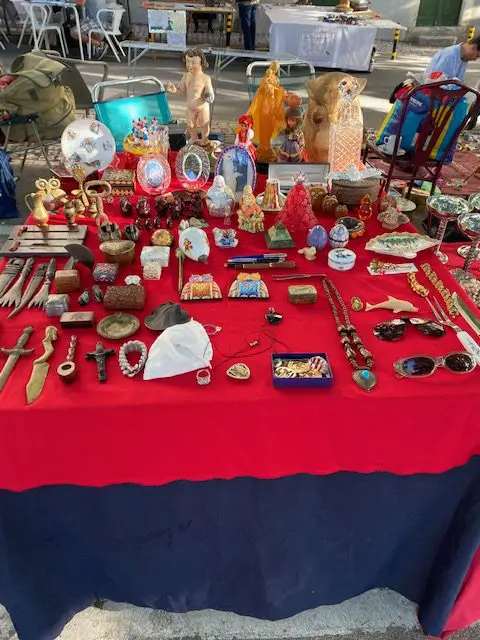 Various wares for sale at the Feira da Ladra flea market.