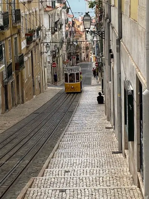 The Ascensor da Bica funicular climbing up Lisbon's Rua da Bica.