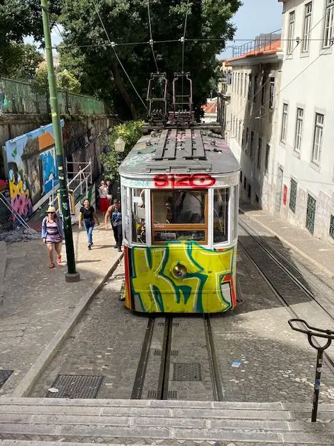 Ascensor da Gloria funicular delivers passengersfrom Restauadores Square to Bairro Alto in Lisbon, Portugal