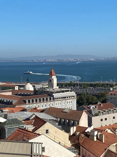 Watching boats on the Tejo River at the Mme Petisca Rooftop Bar, Lisbon