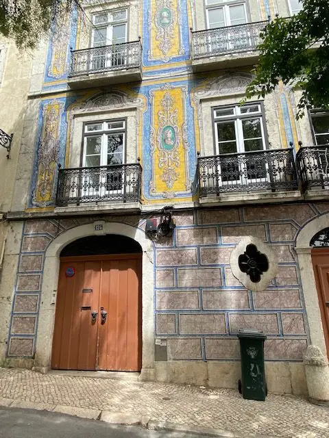 Blue, yellow, white tiled façade at Campo de Santa Clara, 126, Lisbon