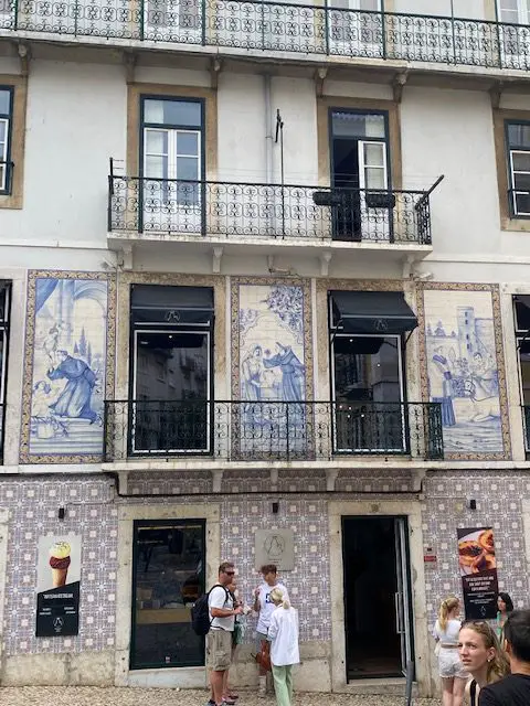 Blue and white tile facade of Palstelaria Santo António, Lisbon.  Located near Lisbon's castle, this bakery also makes some of the best pastéis de nata custard tarts in Lisbon
