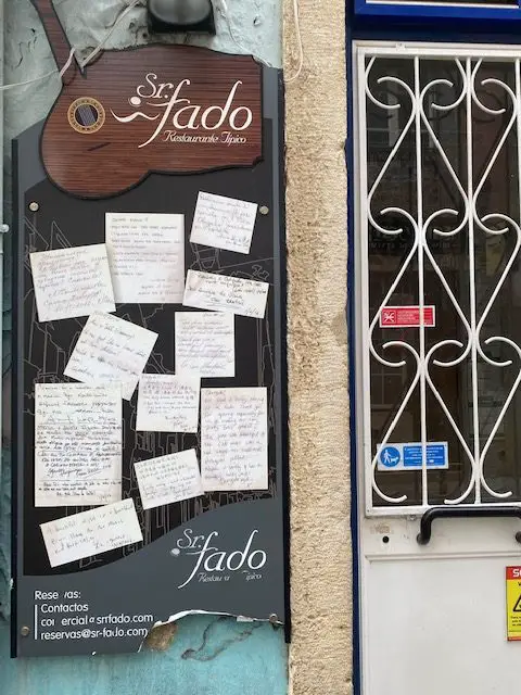 Notes on the door of the Alfama Fado club, Sr. Fado, in Lisbon