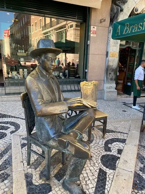 Statue of Fernando Pessoa in front of Cafe a A Brasileira at Lisbon's Chiado Square