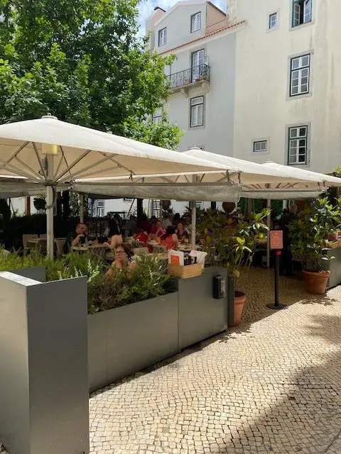 Eating on the terrace at Pizzeria Messogiorno in Lisbon's Chiado neighborhood.