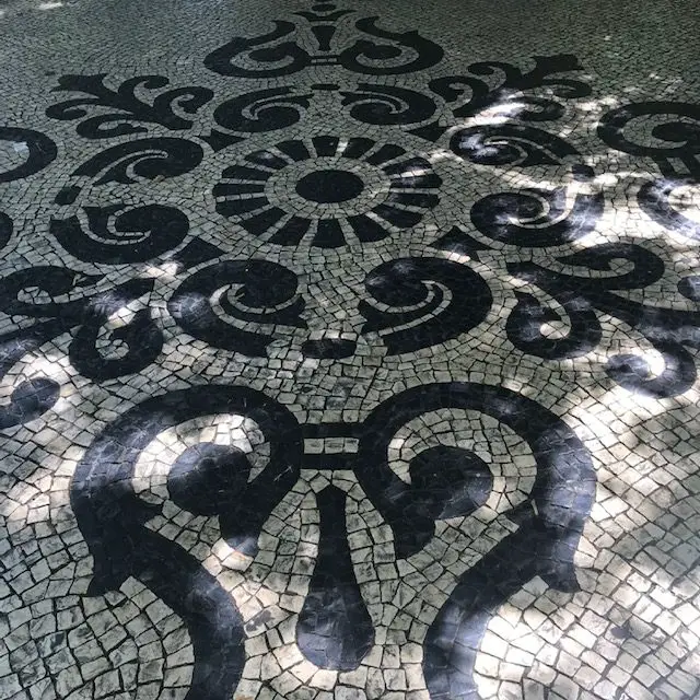 Black and white cobblestone mosaic on Lisbon's Avenida da Liberdade
