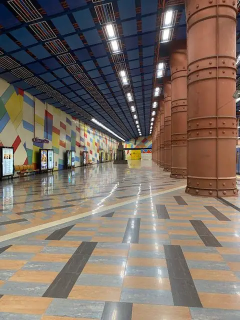 Massive steel columns line the subway platform at Lisbon's Olaias metroo station