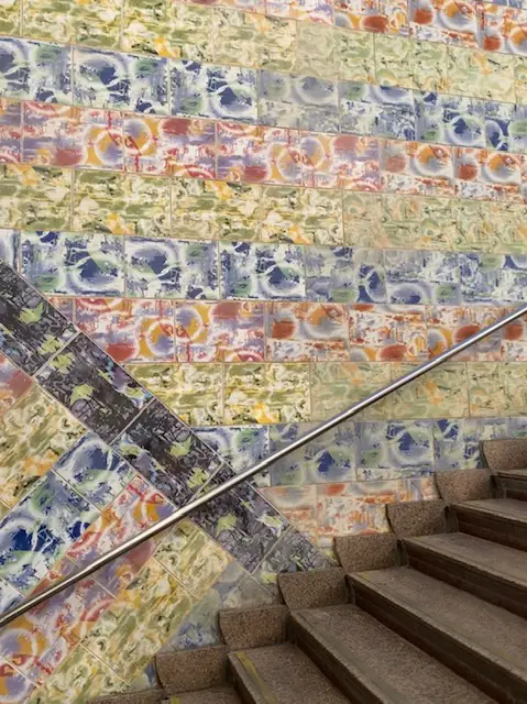 Colorful tiled walls line the stairway access to Lisbon's Olaias metro station