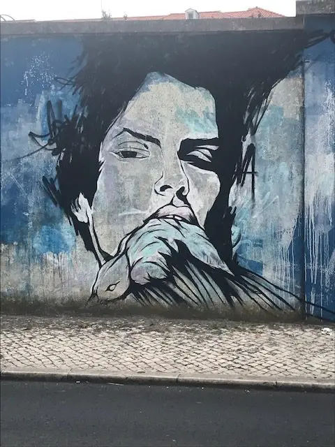 More than a mile of murals on the blue wall surrounding the Julio de Matos Psychiatric Hospital in Lisbon