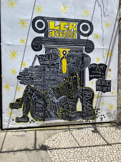 Mural at Lisbon's LX factory advertising the LLer Devagar bookstore
