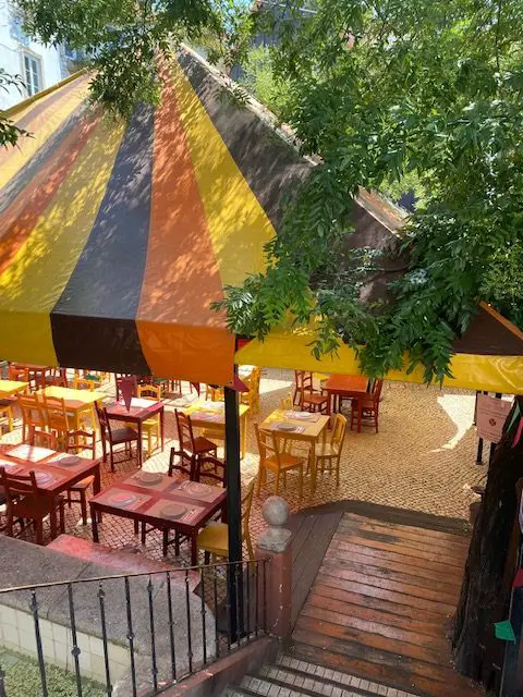 A colorful tent covers the terrace at Lisbon's Chapito a Mesa restaurant