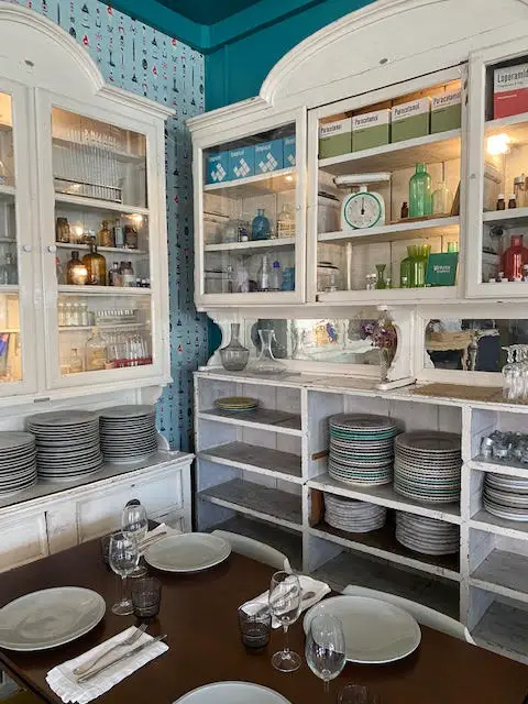 The interior of Pharmacia Felicidade in Lisbon Portugal has an apothecary theme.  Clients will find equipment from early 20th century pharmacies in the dining room.  The restaurant is located in the Pharmacy Museum in Lisbon, Portugal