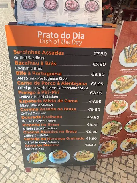 This sign advertised "Prato do dia" - the daily special, at a restaurant on Lisbon's Rua das Portas de Santo Antão