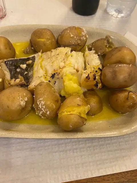 Bacalhau a largareiro served with potatoes at Lisbon's locals' hangout A Provinciana on Travessa do Forno