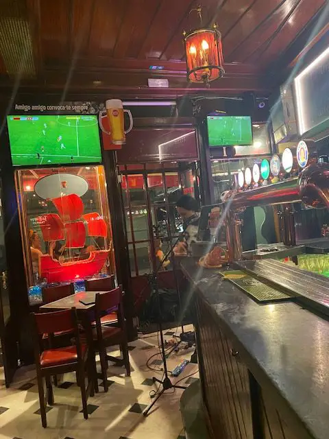 Watch football on the TVs and listen to a guitarist on this night at British Bar, Ltd. in Lisbon, Portugal