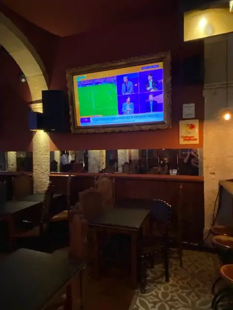 Watching a football game on one of the large screen TVs at the George Gastropub in Lisbon, Portugal