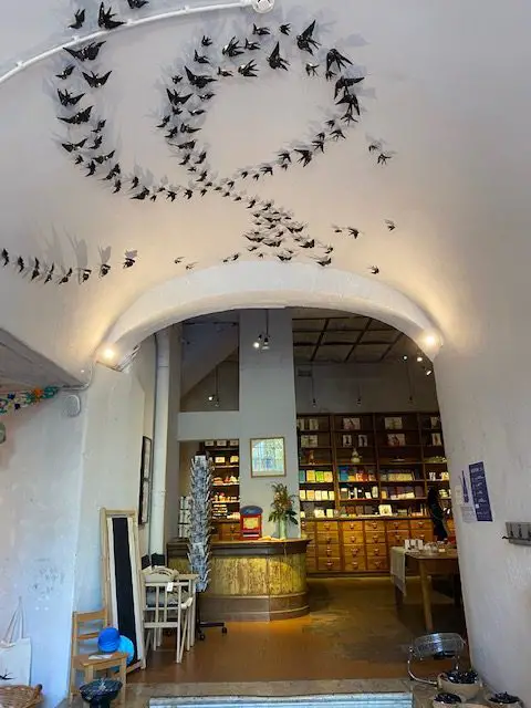 A Vida Portuguesa is one of the most beautifully decorated stores in Lisbon.  Here a spiral bird sculpture adorns the ceiling above the arched doorway at A Vida Portuguesa's flagship store on Largo do Intendente