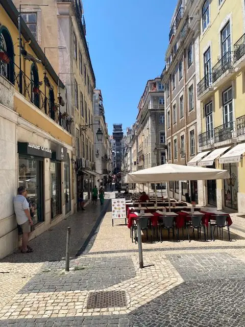 Looking west down Lisbon's Rua de Santa Justa.  The wrought-iron Santa Justa Lift is the focal point at the end of the street.