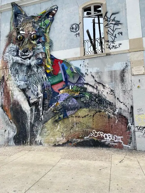 "Raposa" the giant fox made out of recycled materials by plastic artist Bordallo II adorns an abandoned building at Avenida 24 de Julho in Lisbon, Portugal