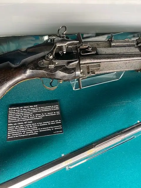 An 18th-century flintlock rifle, cal. 13mm. with a rotating block of four chambers each with its own frizzen.  This gun is on display at the Military Museum of Lisbon.