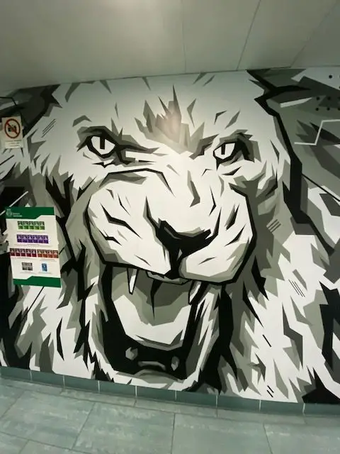 Sporting CP's mascot is the White Lion.  This black and white lino mural is in an interior hallway at Sporting Lisbon's José Alvalade Stadium.