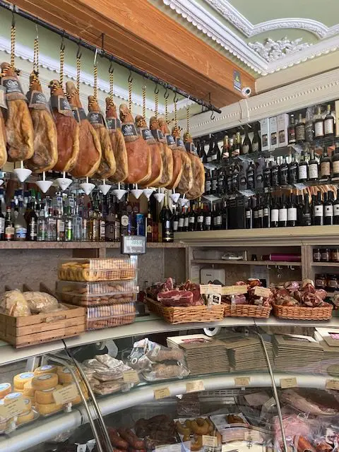 The traditional, family-owned bodega Manteigaria Silvs has been selling wine, ham, cheese, and other provisions in Lisbon since 1890.  Today it is one of Lisbon's "Lojas com  Historia" - sotres with history.