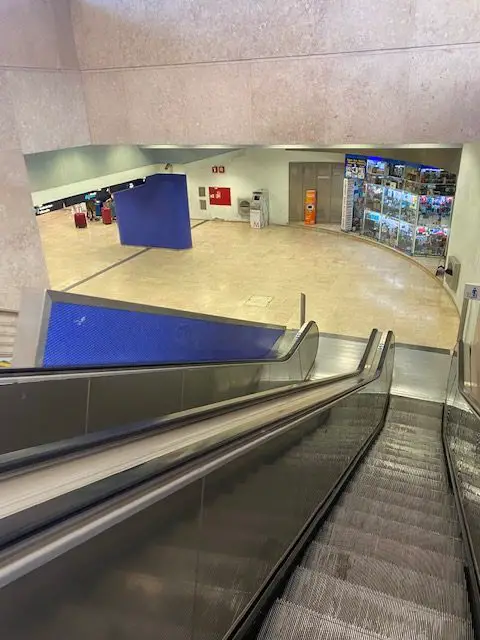 Going down the escalator to the Terreiro do Paço Metro Station platforms in Lisbon