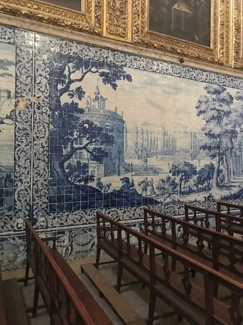 Gilded panels and blue and white azulejo tiles contrast with Brazil wood in the Igreja da Madre de Deus Church that is today part of the National Tile Museum in Lisbon, Portugal